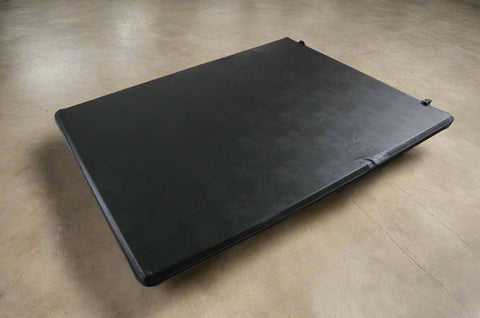 Tri-fold soft tonneau cover installed on Ford F-150 6.5 ft bed
Roll-up tonneau cover for 2009–2020 Ford truck bed
Weatherproof vinyl truck bed cover with clamp system
Tonneau cover folded up showing bed access
Side view of tri-fold tonneau cover on Ford F-150