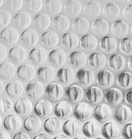 Roll of Reflective Foil Bubble Insulation – 4 FT x 25 FT

Close-up of Bubble Film Core Laminated with Foil Layers

Cross-Section of Reflective Insulation Showing 2-Layer Foil

Foil Bubble Roll Partially Unrolled for Indoor Gardening