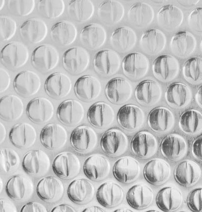 Roll of Reflective Foil Bubble Insulation – 4 FT x 25 FT

Close-up of Bubble Film Core Laminated with Foil Layers

Cross-Section of Reflective Insulation Showing 2-Layer Foil

Foil Bubble Roll Partially Unrolled for Indoor Gardening