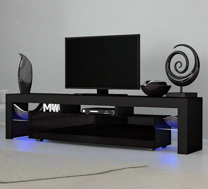 Modern RGB LED TV stand with lights under flat-screen TV
Black gloss entertainment unit with RGB lights in living room
White TV console with open shelving and LED lighting
Stylish high gloss media cabinet with mood lighting
Contemporary entertainment center for 75 inch TVs