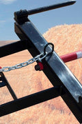 Triple Hay Bale Spears Attachment – Mounted on Loader

49-Inch Spear Fork Attachment – Top View

Bucket Attachment for Hay Bales – Side View

HY49 Red Steel Frame with Spears – Ground Placement

Close-up of Chains and Turnbuckle on Bucket Attachment

