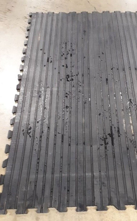 textured rubber stall mat close-up for horse barn