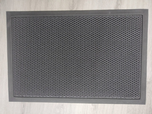 Heavy-duty 2x3 FT dirt catcher mat on light wood floor
Non-slip rubber backing for entry mat safety
Rolled-up doormat showing thickness and texture
Close-up of dirt-trapping texture on entry mat