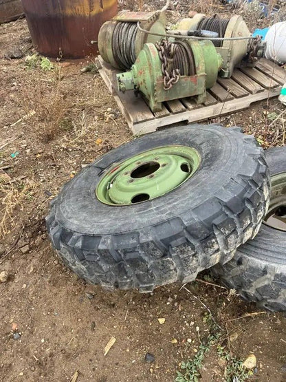 9.00R16 Michelin – Military Surplus Tire & Rim Assembly (Assorted Tread Patterns) - with Very Little Cracking if any | Sold by Uncle Wiener's Wholesale