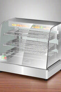 Stainless Steel Food Warmer Display with adjustable shelves
Commercial countertop heated showcase with tempered glass
Food warmer case for restaurant buffet or bakery
Side view of commercial hot food display unit
Interior of stainless steel food warmer with trays