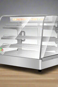 Stainless Steel Food Warmer Display with adjustable shelves
Commercial countertop heated showcase with tempered glass
Food warmer case for restaurant buffet or bakery
Side view of commercial hot food display unit
Interior of stainless steel food warmer with trays