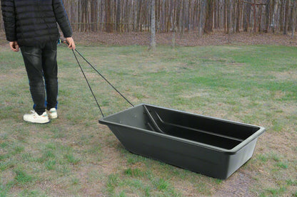Heavy-duty black utility sled for winter outdoor hauling
Plastic hunting sled with tow rope and rugged HDPE build
Side view of winter snow sled for gear and firewood transport
