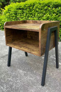 Stackable rustic wood and metal nightstand in bedroom
Industrial bedside table with black metal legs
Dual-tier MDF nightstand in modern space
Wooden nightstand stacked for storage
Compact rustic nightstand for small room