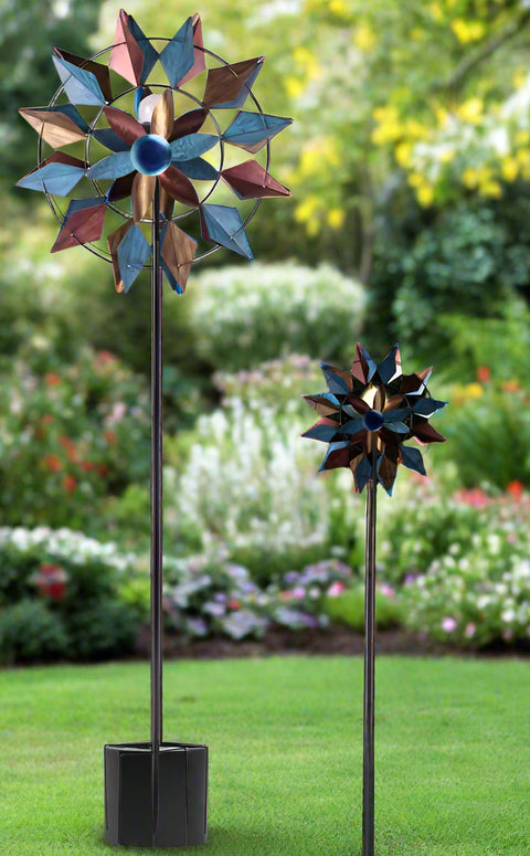 Solar metal wind spinner with LED light glowing in garden
Dual-blade kinetic wind spinner for patio and flower bed
Decorative garden stake spinner with stable base
Solar-powered wind spinner during daytime
Outdoor spinner LED kinetic sculpture