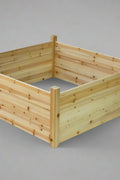 Raised wooden planter box 48x48x19 inches

Assembled garden bed in outdoor setup

Elevated wooden raised bed with soil

Planter box filled with vegetables

Easy slide-in dovetail joint design
