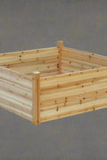 Raised wooden planter box 48x48x19 inches

Assembled garden bed in outdoor setup

Elevated wooden raised bed with soil

Planter box filled with vegetables

Easy slide-in dovetail joint design