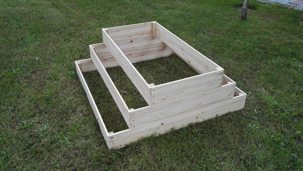 3-tier wooden raised garden bed on lawn
Step-style cedar planter box for vegetables and herbs
Easy-to-assemble elevated garden bed with tiered design

Outdoor wooden planter with 3 levels for home gardening
Spacious planter box for backyard flower and herb gardens
Durable raised bed for patio vegetable planting