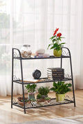 3-tier metal plant stand with potted plants in living room
Black powder-coated plant rack used indoors
Metal flower shelf displayed on outdoor patio
Sturdy decorative stand with three storage tiers
Compact garden shelf holding flowers and décor items
Close-up of black metal frame and assembly