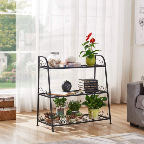 3-tier metal plant stand with potted plants in living room
Black powder-coated plant rack used indoors
Metal flower shelf displayed on outdoor patio
Sturdy decorative stand with three storage tiers
Compact garden shelf holding flowers and décor items
Close-up of black metal frame and assembly