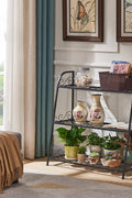3-tier metal plant stand with potted plants in living room
Black powder-coated plant rack used indoors
Metal flower shelf displayed on outdoor patio
Sturdy decorative stand with three storage tiers
Compact garden shelf holding flowers and décor items
Close-up of black metal frame and assembly