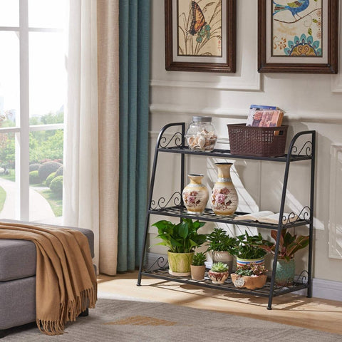 3-tier metal plant stand with potted plants in living room
Black powder-coated plant rack used indoors
Metal flower shelf displayed on outdoor patio
Sturdy decorative stand with three storage tiers
Compact garden shelf holding flowers and décor items
Close-up of black metal frame and assembly