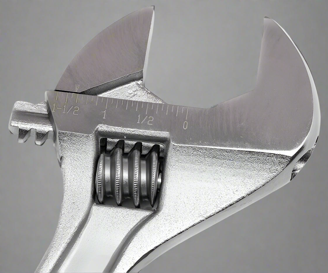 Close-up of adjustable crescent wrench wide-opening jaw and chrome polished surface