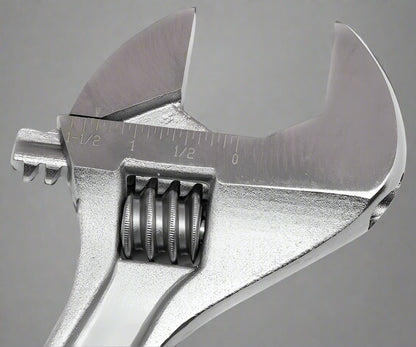 Close-up of adjustable crescent wrench wide-opening jaw and chrome polished surface
