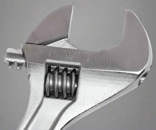 Close-up of adjustable crescent wrench wide-opening jaw and chrome polished surface