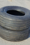 Stacked farm implement tires for agricultural equipment and trailer use