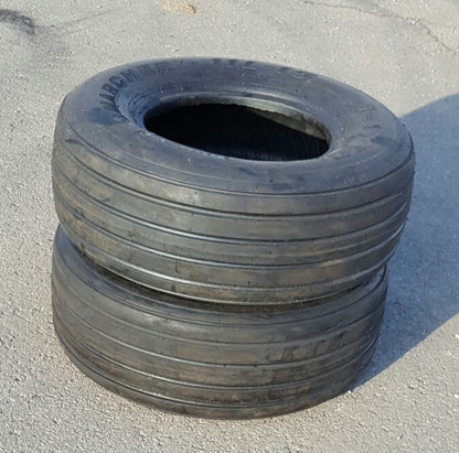 Stacked farm implement tires for agricultural equipment and trailer use
