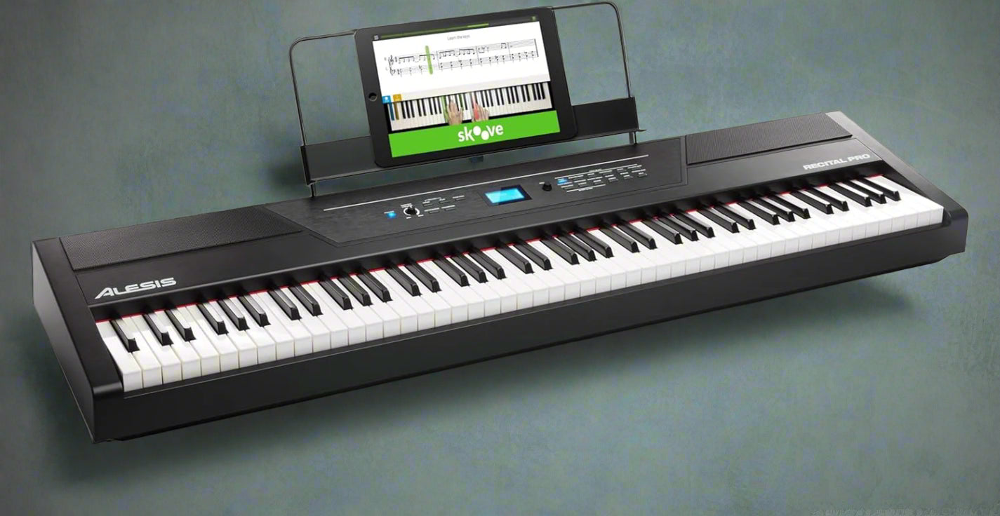 “Alesis Recital Pro 88-key digital piano front view”

“Alesis piano with built-in speakers and full-size weighted keys”

“88-key hammer action electric piano for beginners and pros”

“Rear panel of Alesis Recital Pro showing inputs and outputs”

“Close-up of control panel and FX buttons on Alesis keyboard”
