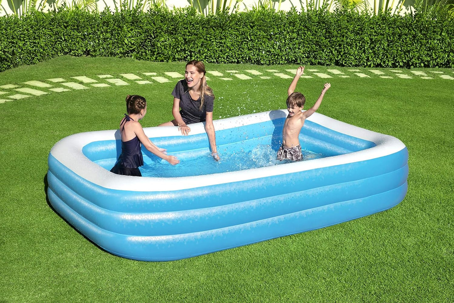 Bestway inflatable rectangular paddling pool with family inside

Top-down view of Bestway blue inflatable pool

Inflatable pool on grass with children playing

Side angle of Bestway pool showing two air chambers

Dimensions of Bestway family pool

Family enjoying inflatable pool in the backyard

Rectangular Bestway paddling pool setup outdoors