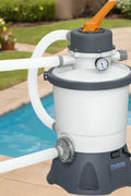 Bestway Flowclear sand filter pump for above-ground pools – front view
Pool pump with strainer basket and clamp system – Model 58516
Above-ground pool filter pump system in use with pool setup