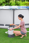 Bestway Flowclear sand filter pump for above-ground pools – front view
Pool pump with strainer basket and clamp system – Model 58516
Above-ground pool filter pump system in use with pool setup