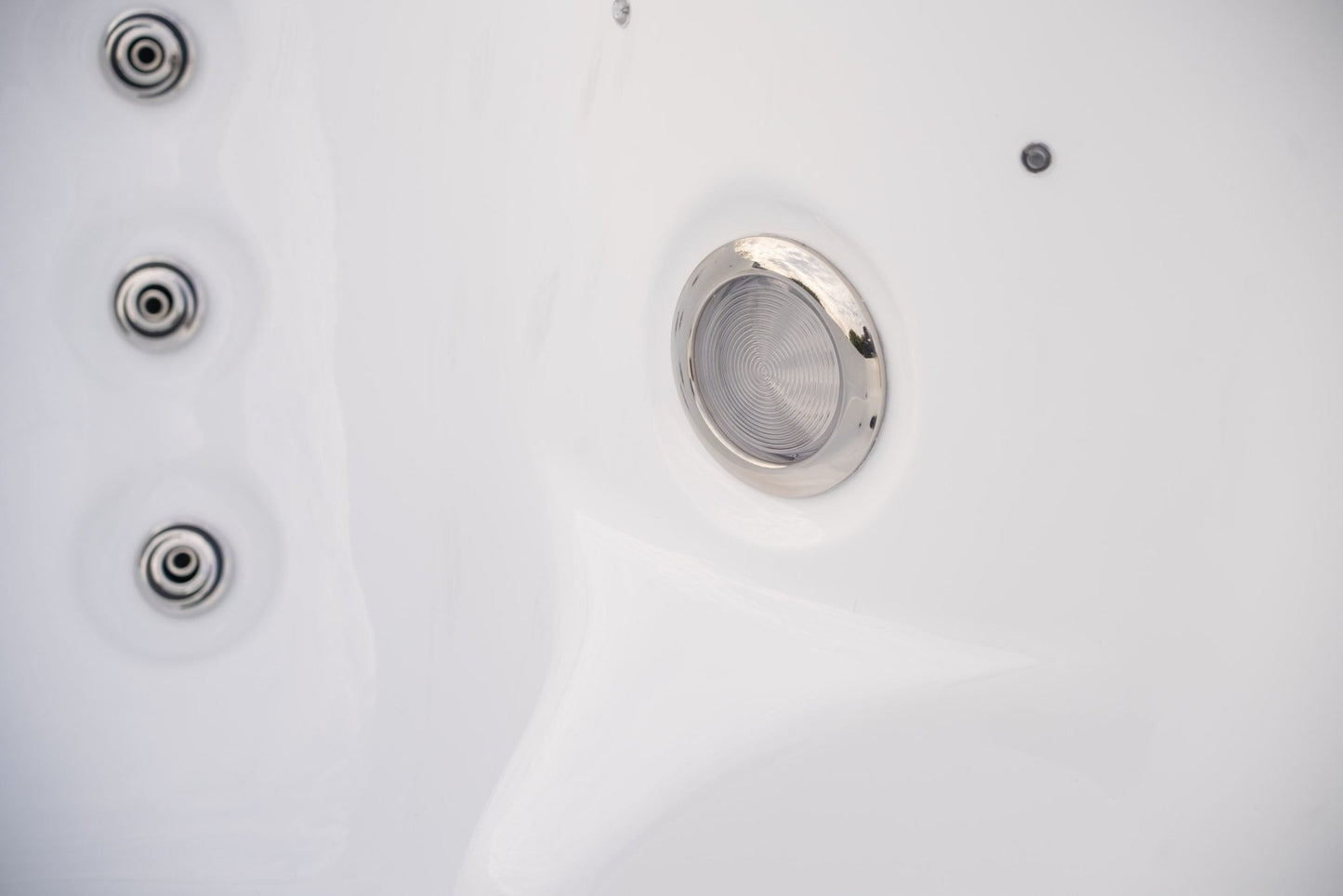 Close-up of hydrotherapy jets system in small spa tub