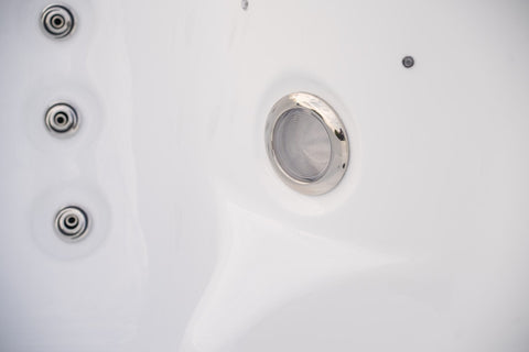 Close-up of hydrotherapy jets system in small spa tub