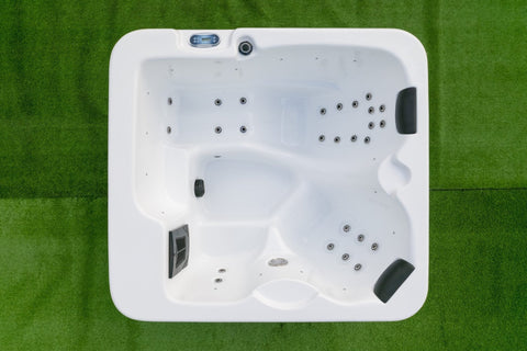 Backyard hot tub with full lounger and upright seating for relaxation