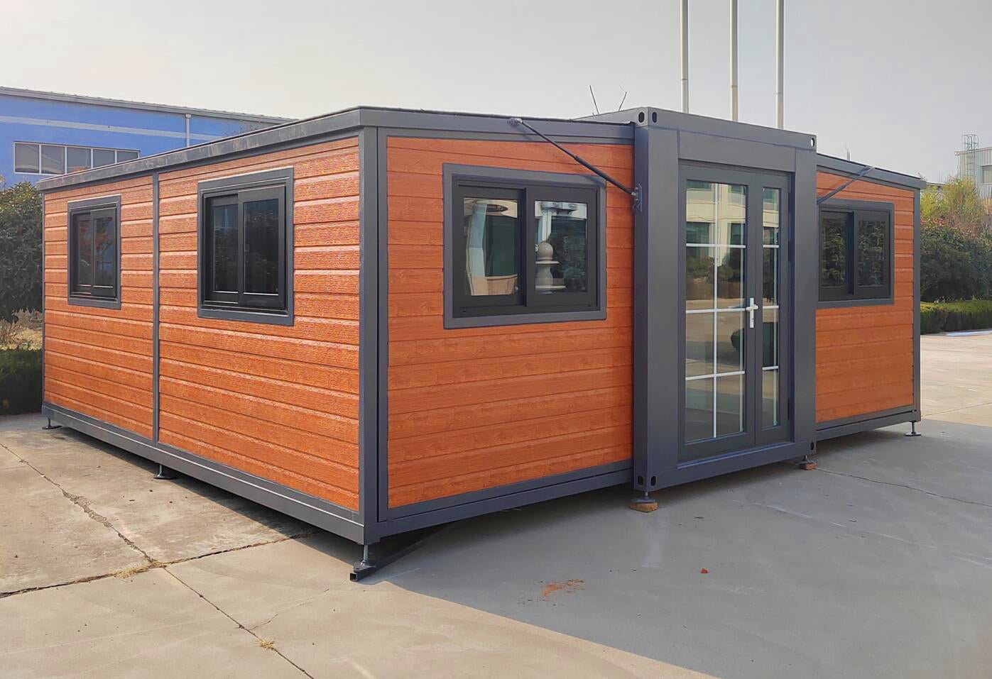 Deluxe Prefabricated Folding House – 2 Bedrooms, Kitchen, Electric Setup, Model: 0206DLX - with Roof Kit With Porch | Sold by Uncle Wiener's Wholesale