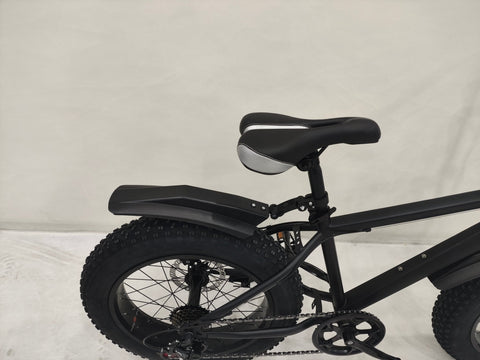 Deviant 20-inch fat tire off-road bike on the beach

Side view of 7-speed fat tire bike with disc brakes

Shimano derailleur on Deviant fat tire bike

Close-up of front disc brake and suspension fork

All-season fat tire bike on snow and gravel terrain