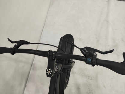 Deviant 20-inch fat tire off-road bike on the beach

Side view of 7-speed fat tire bike with disc brakes

Shimano derailleur on Deviant fat tire bike

Close-up of front disc brake and suspension fork

All-season fat tire bike on snow and gravel terrain