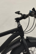 Deviant 20-inch fat tire off-road bike on the beach

Side view of 7-speed fat tire bike with disc brakes

Shimano derailleur on Deviant fat tire bike

Close-up of front disc brake and suspension fork

All-season fat tire bike on snow and gravel terrain