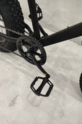 Deviant 20-inch fat tire off-road bike on the beach

Side view of 7-speed fat tire bike with disc brakes

Shimano derailleur on Deviant fat tire bike

Close-up of front disc brake and suspension fork

All-season fat tire bike on snow and gravel terrain