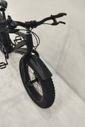 Deviant 20-inch fat tire off-road bike on the beach

Side view of 7-speed fat tire bike with disc brakes

Shimano derailleur on Deviant fat tire bike

Close-up of front disc brake and suspension fork

All-season fat tire bike on snow and gravel terrain