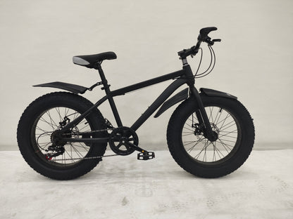 Deviant 20-inch fat tire off-road bike on the beach

Side view of 7-speed fat tire bike with disc brakes

Shimano derailleur on Deviant fat tire bike

Close-up of front disc brake and suspension fork

All-season fat tire bike on snow and gravel terrain