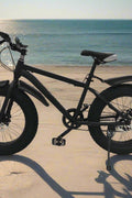 Deviant 20-inch fat tire off-road bike on the beach

Side view of 7-speed fat tire bike with disc brakes

Shimano derailleur on Deviant fat tire bike

Close-up of front disc brake and suspension fork

All-season fat tire bike on snow and gravel terrain