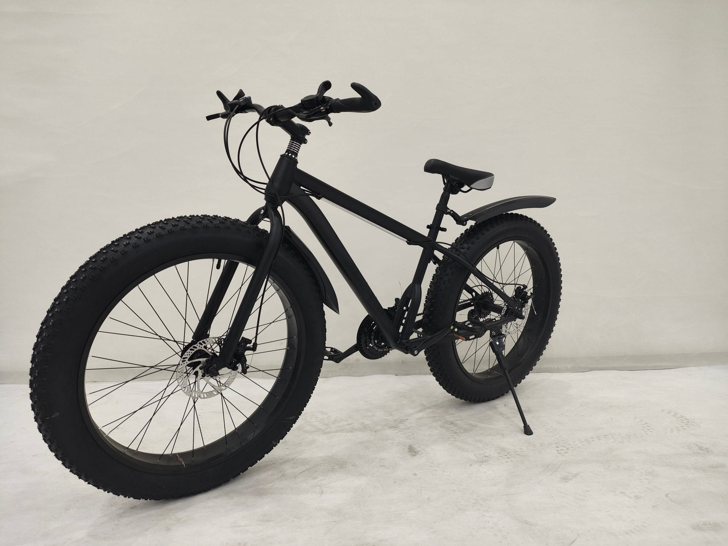 Deviant 26 inch fat tire bike side view on beach
Close-up of Shimano gear and disc brakes
All-terrain mountain bike with wide tires
Fat bike for snow, sand, and trails - Deviant 26 inch