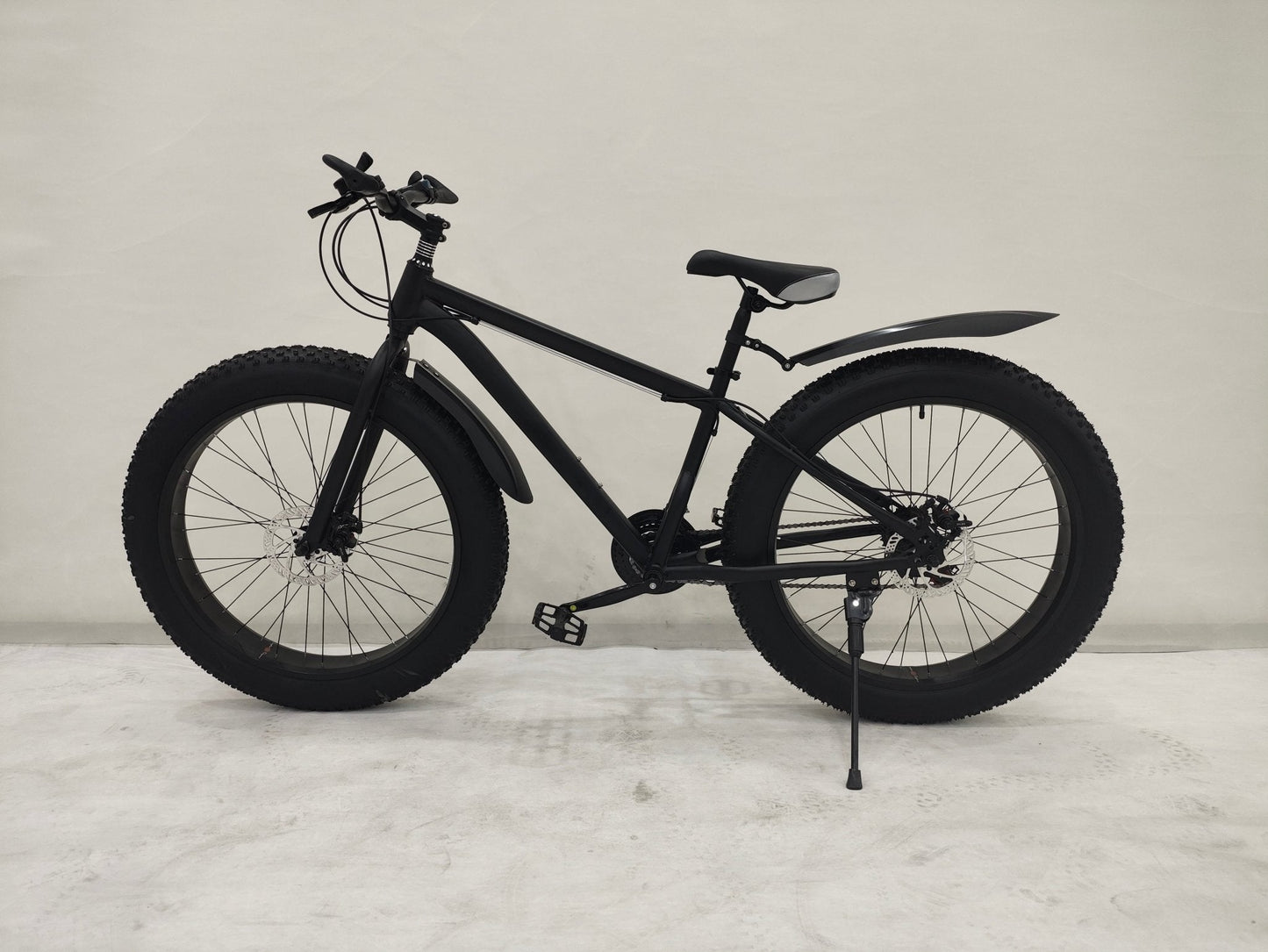 Deviant 26 inch fat tire bike side view on beach
Close-up of Shimano gear and disc brakes
All-terrain mountain bike with wide tires
Fat bike for snow, sand, and trails - Deviant 26 inch