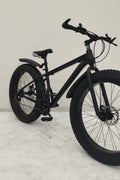 Deviant 26 inch fat tire bike side view on beach
Close-up of Shimano gear and disc brakes
All-terrain mountain bike with wide tires
Fat bike for snow, sand, and trails - Deviant 26 inch