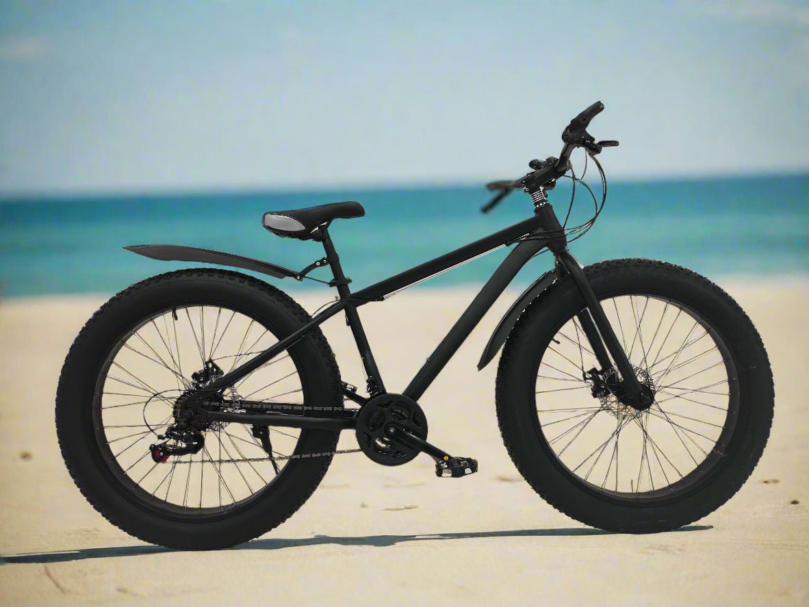 Deviant 26 inch fat tire bike side view on beach
Close-up of Shimano gear and disc brakes
All-terrain mountain bike with wide tires
Fat bike for snow, sand, and trails - Deviant 26 inch