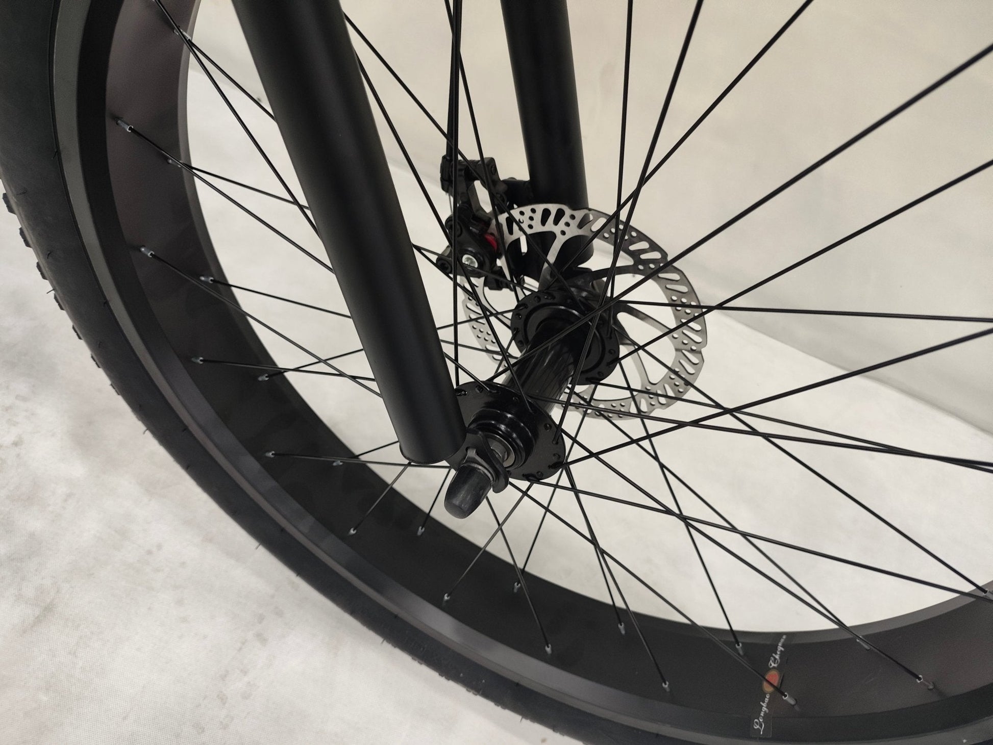 Deviant 26 inch fat tire bike side view on beach
Close-up of Shimano gear and disc brakes
All-terrain mountain bike with wide tires
Fat bike for snow, sand, and trails - Deviant 26 inch