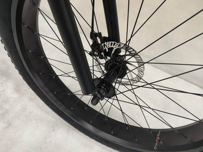 Deviant 26 inch fat tire bike side view on beach
Close-up of Shimano gear and disc brakes
All-terrain mountain bike with wide tires
Fat bike for snow, sand, and trails - Deviant 26 inch