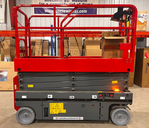 GTJZ08 Electric Scissor Lift full view in warehouse

Platform view showing foldable guardrails

Lift extended to 10M with worker on platform

Side profile highlighting tire system

Control panel and safety features close-up