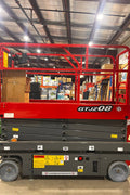 GTJZ08 Electric Scissor Lift full view in warehouse

Platform view showing foldable guardrails

Lift extended to 10M with worker on platform

Side profile highlighting tire system

Control panel and safety features close-up