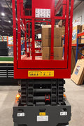 GTJZ08 Electric Scissor Lift full view in warehouse

Platform view showing foldable guardrails

Lift extended to 10M with worker on platform

Side profile highlighting tire system

Control panel and safety features close-up