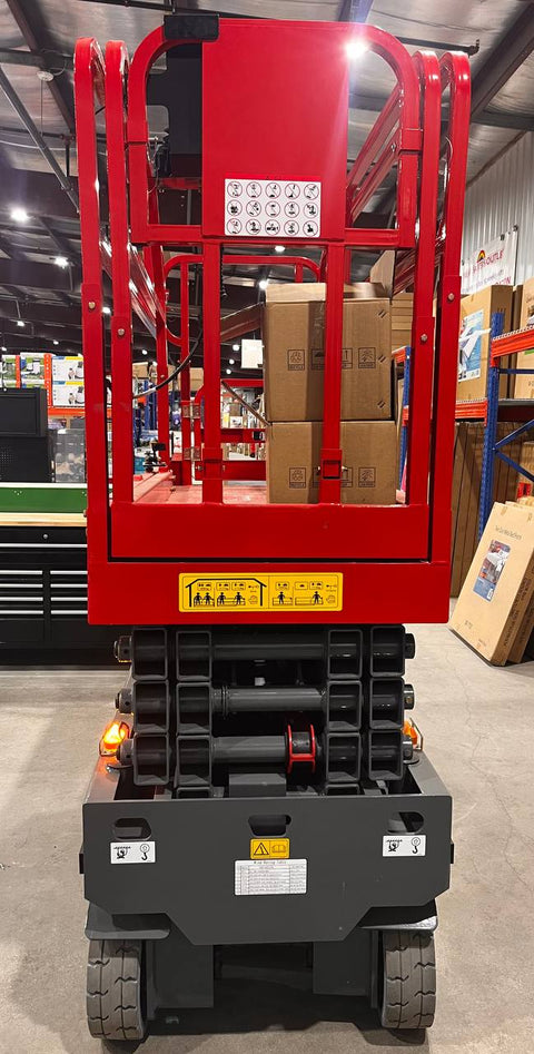 GTJZ08 Electric Scissor Lift full view in warehouse

Platform view showing foldable guardrails

Lift extended to 10M with worker on platform

Side profile highlighting tire system

Control panel and safety features close-up